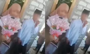 Dalam video tersebut, dua pengantin yang tidak disebutkan namanya tersebut terlihat sedang berdiri di sebuah teras rumah dan tengah menjamu tamu.